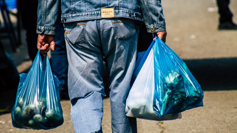 Carrying groceries in plastic bags