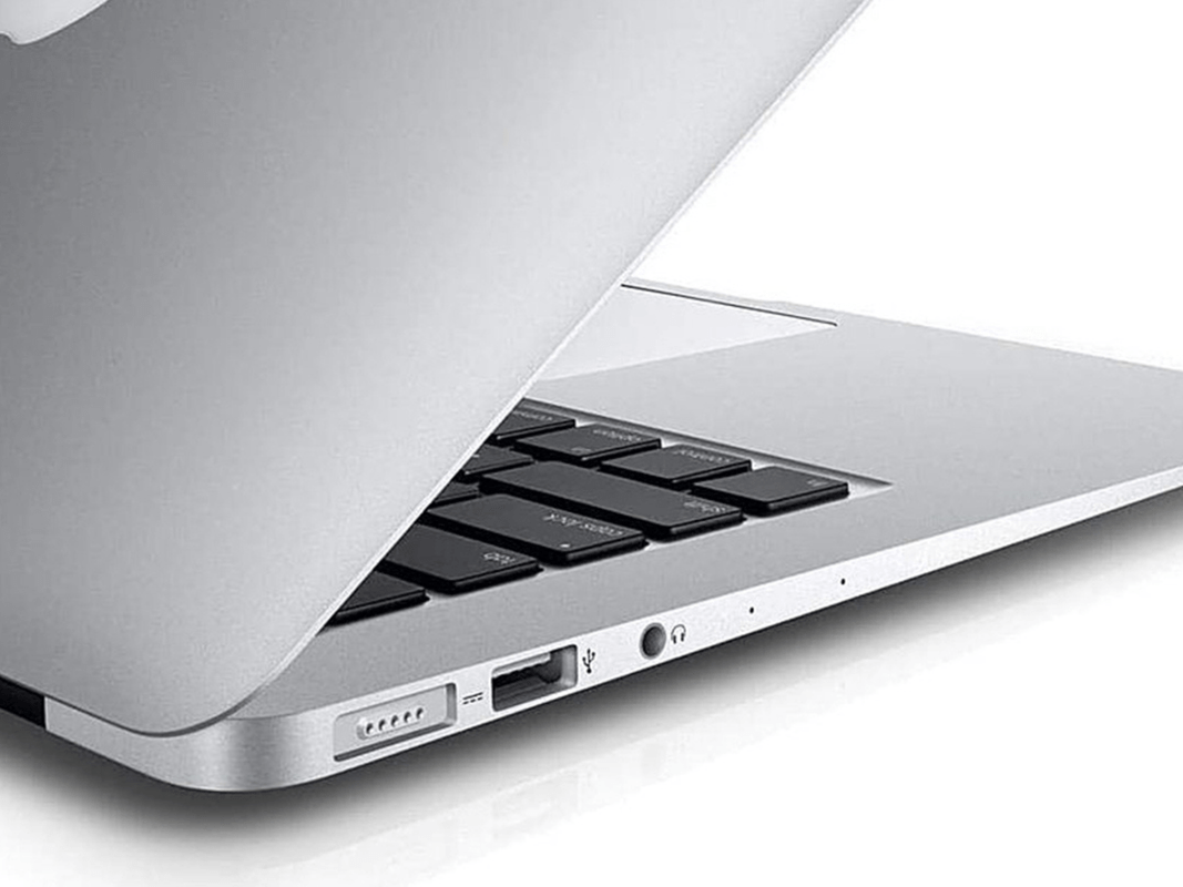 A refurbished MacBook Air on a plain background