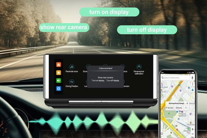 A portable dashboard display attached to a car and connected to a phone.