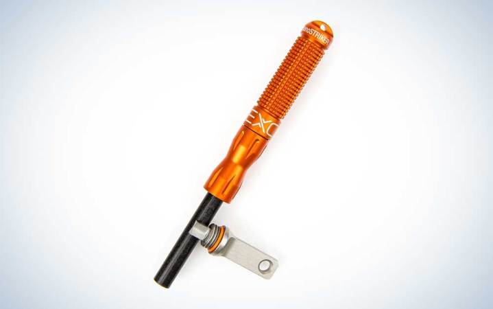  An orange Exotac nanoSTRIKER on a plain background.