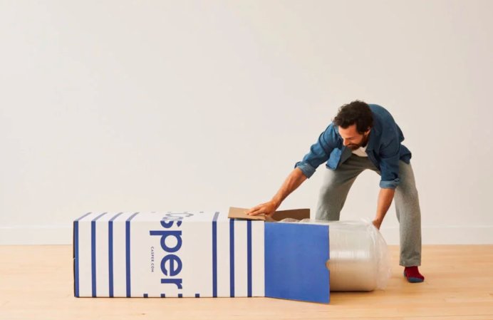 A man unloading a Casper mattress