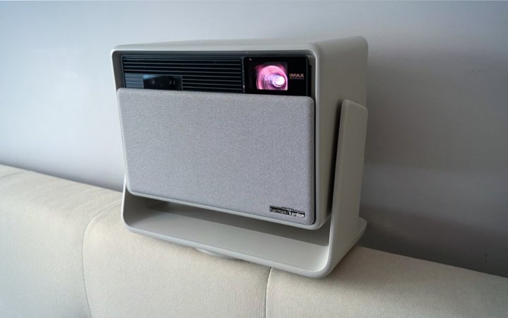  Misty Gold XGIMI Horizon S Max lifestyle projector sitting on the back of a white couch