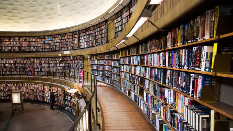 three stories of round library shelves