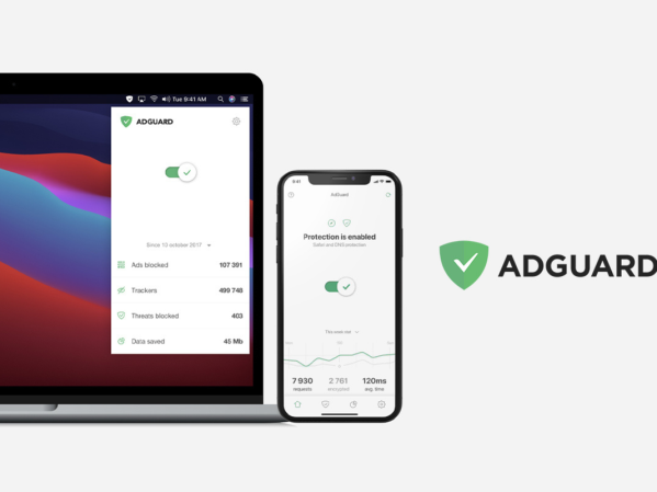 A laptop and phone with AdGuard pulled up.