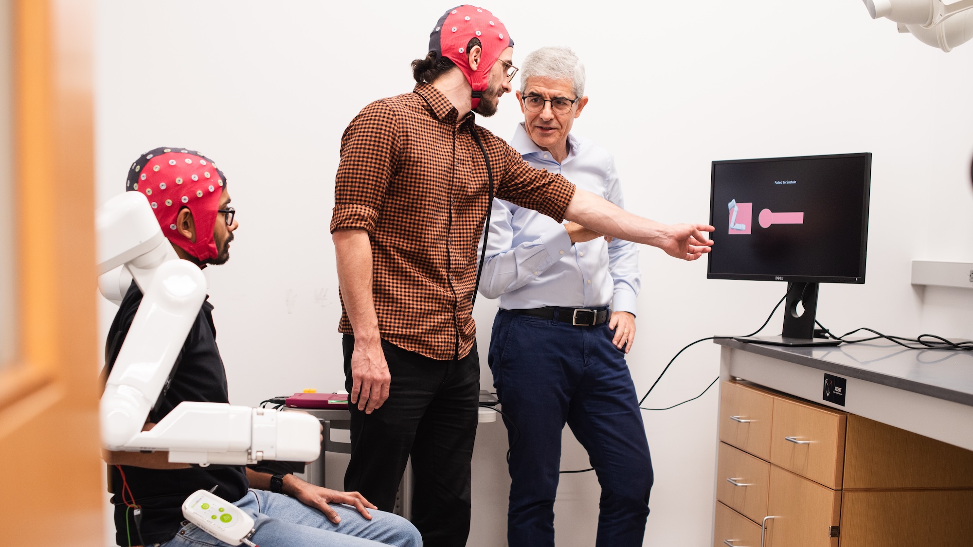 Users wearing BCI cap to play video game