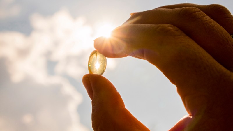 Vitamin D capsule in the sun