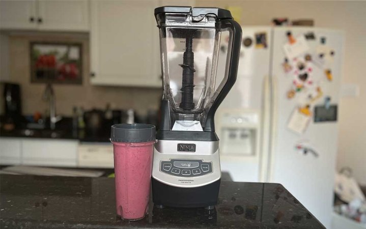  A Ninja BL660 Professional Compact Blender sitting on a counter.