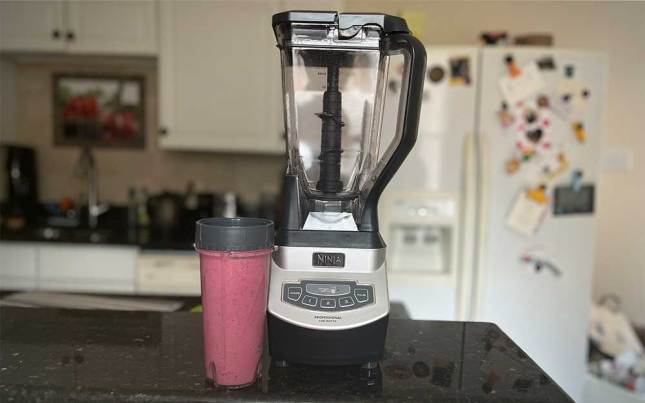 A Ninja BL660 Professional Compact Blender sitting on a counter.