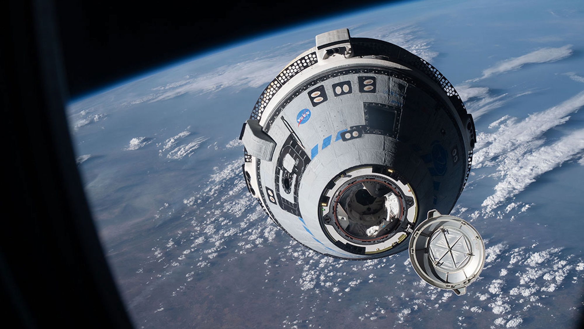 The CST-100 Starliner autonomously approaches the International Space Station during the uncrewed Orbital Flight Test-2 in May 2022.