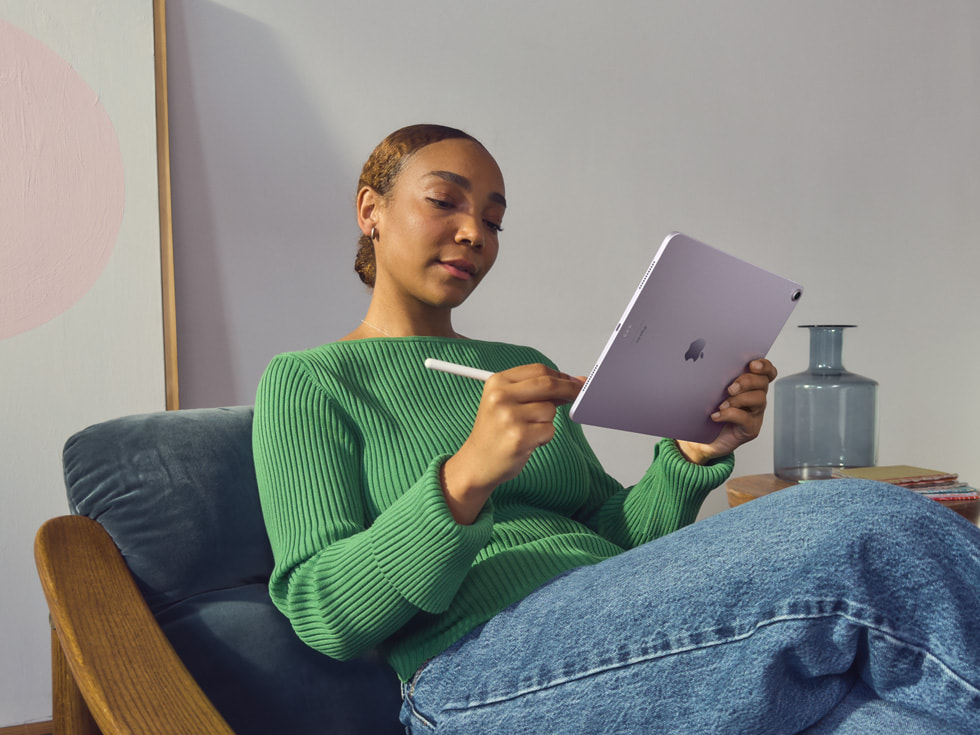 A person writing on a new M2 iPad Air with an Apple Pencil.