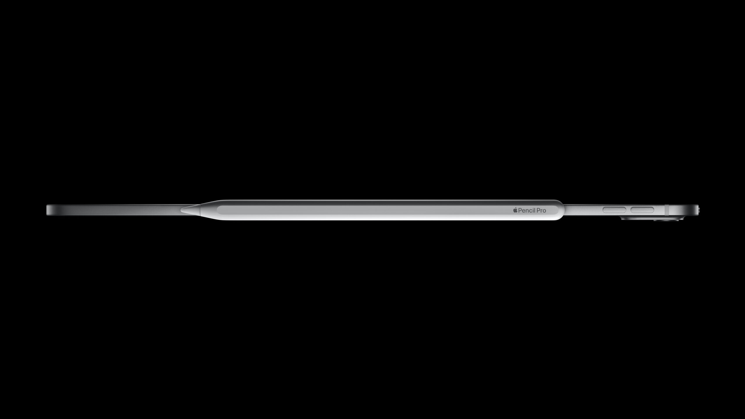 The new Apple Pencil Pro sitting on top of the new iPad Pro.