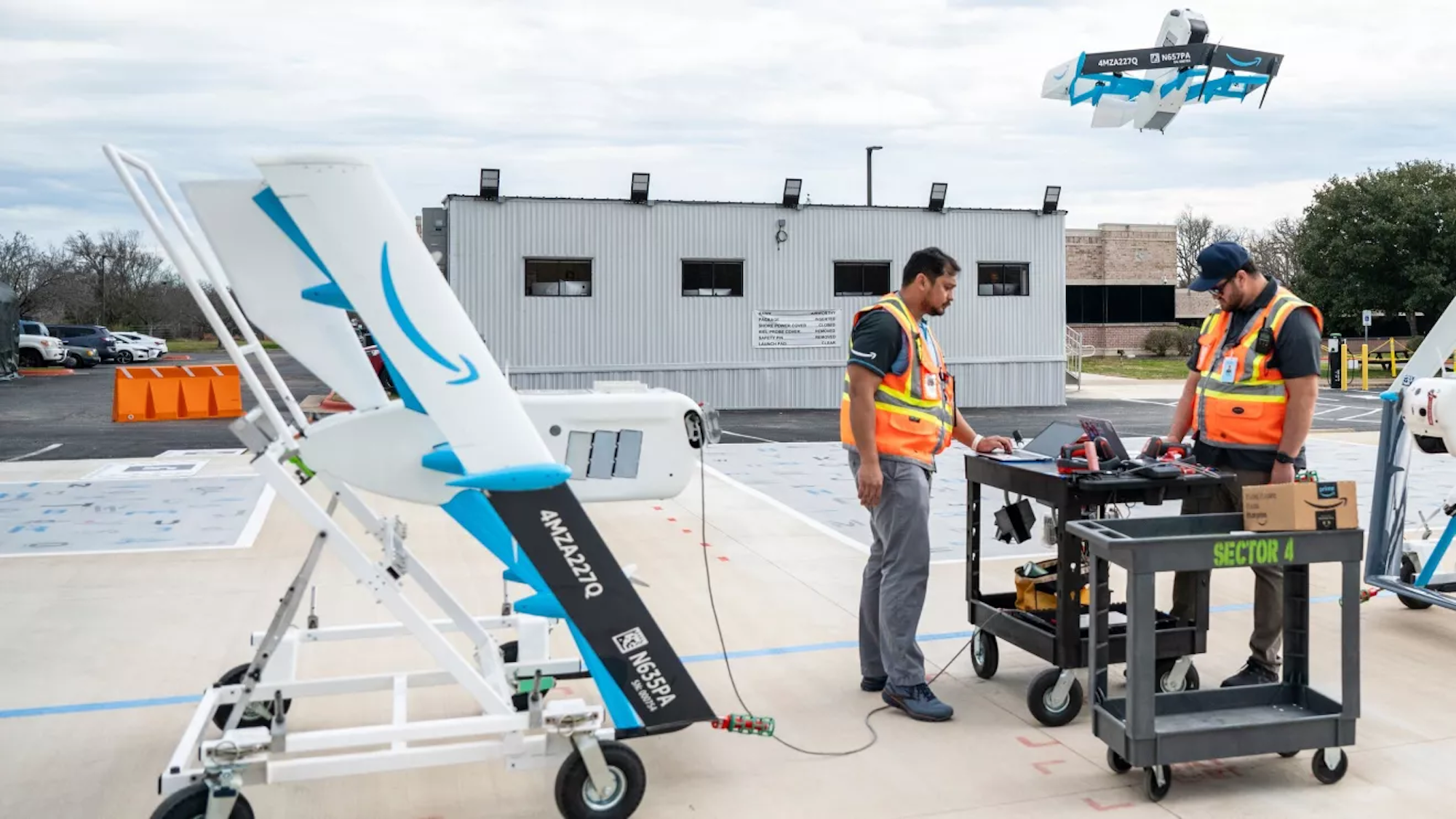 Amazon workers testing Prime Air drones outside