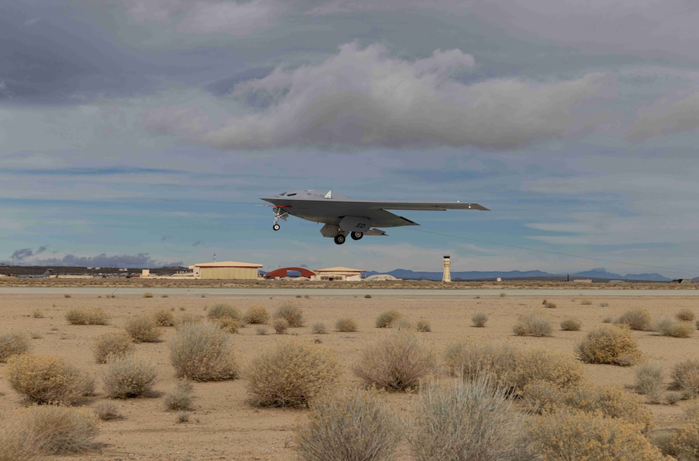 B-21 Raider stealth bomber taking off from desert runway