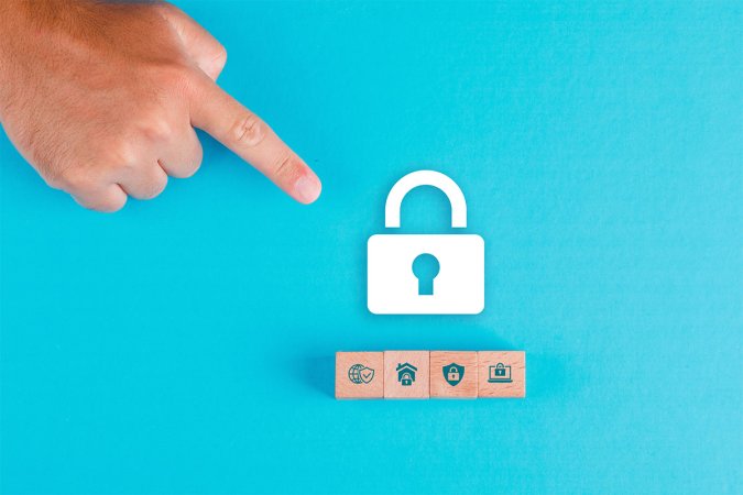 A person pointing to an icon of a white lock on a blue background.