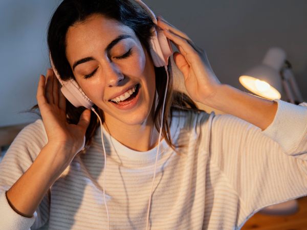 A person wearing headphones and listening to music.