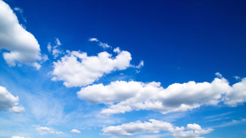 white fluffy clouds on blue sky