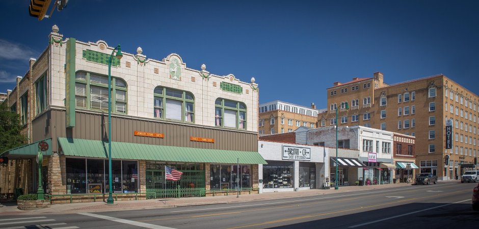 a small town street with one and two-story buildings