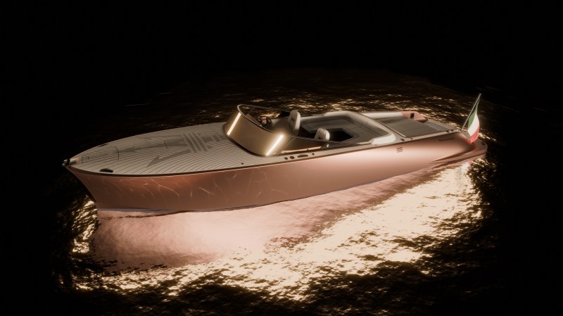 a rose gold boat sits on the water at night