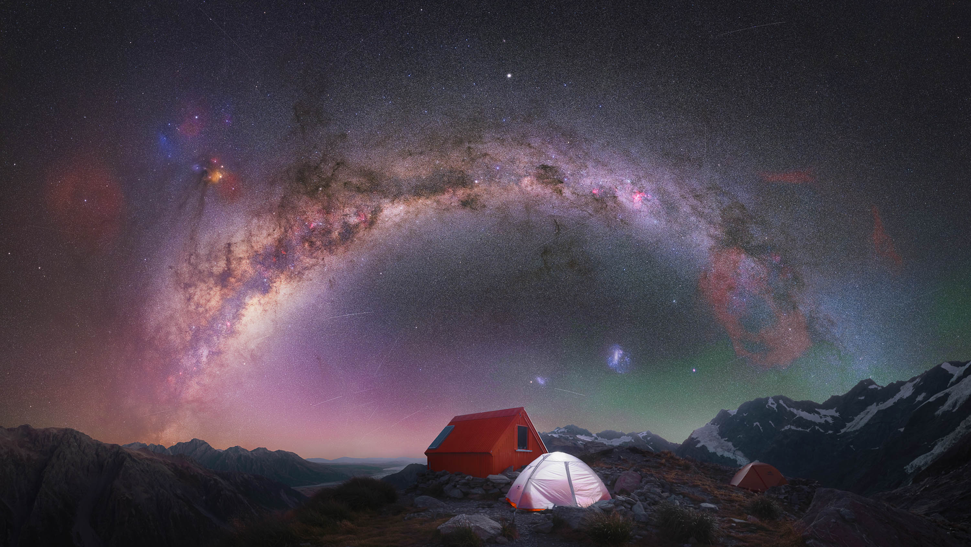 milky way above a barn and tent