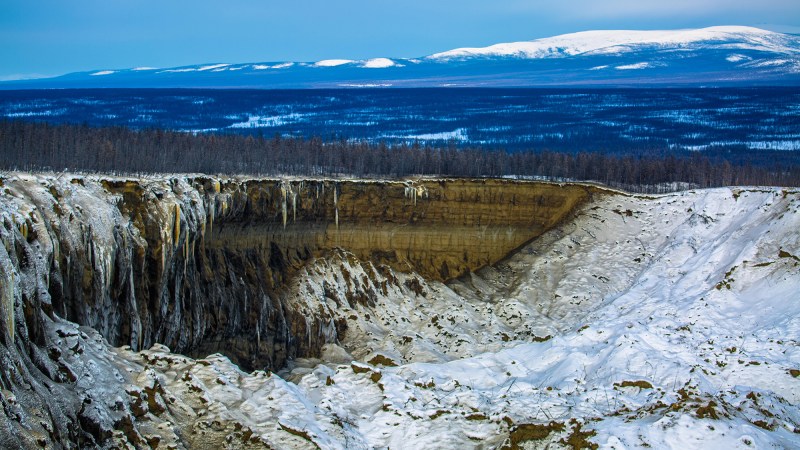 A huge thermokarst crater showing the damage to the permafrost and our climate, Batagay, Russia.