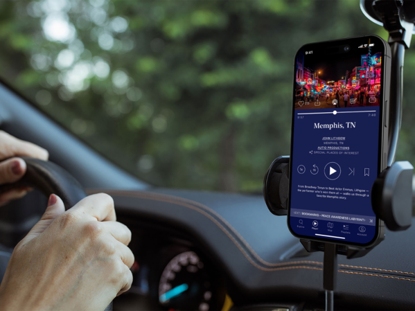 A person driving while listening to stories on Autio, a storytelling app.