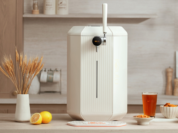 A homemade beer brewer sitting on a table.