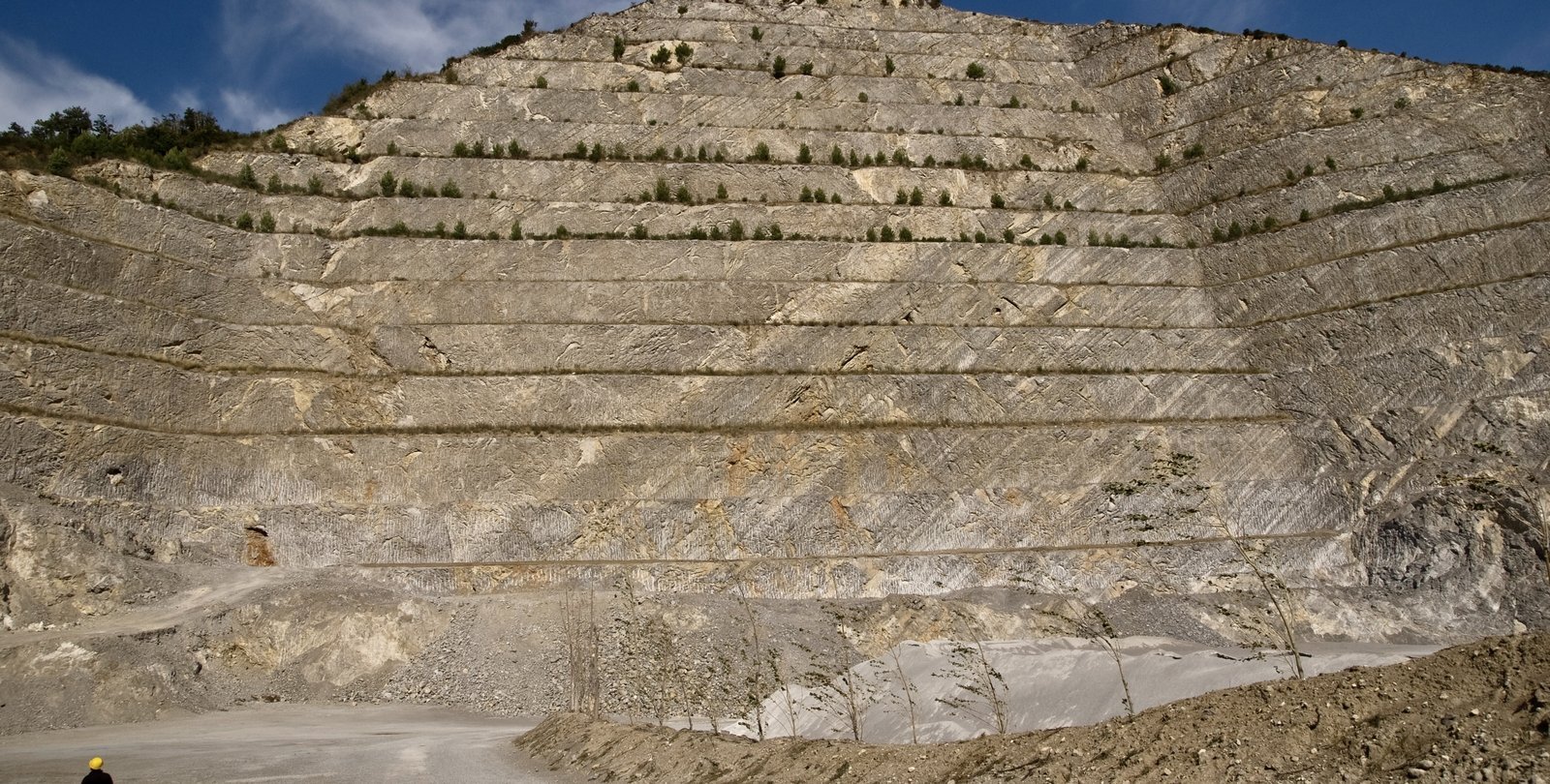 A quarry illustrating bands of stratified limestone from the ancient seafloor in what is now Mercato San Severino in Italy.