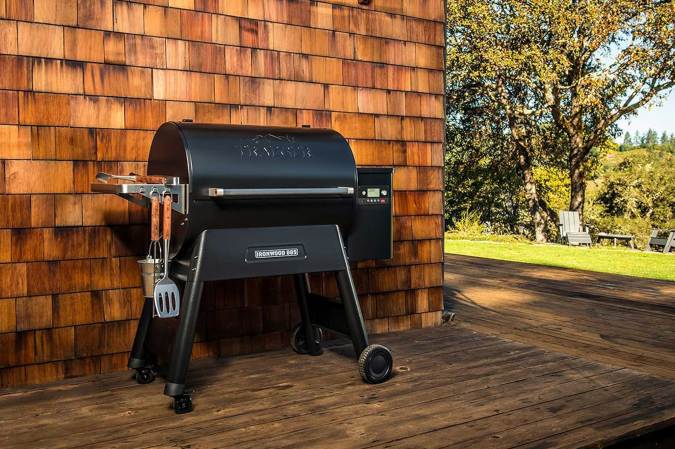A Traeger Ironwood 885 grill sitting on a patio.