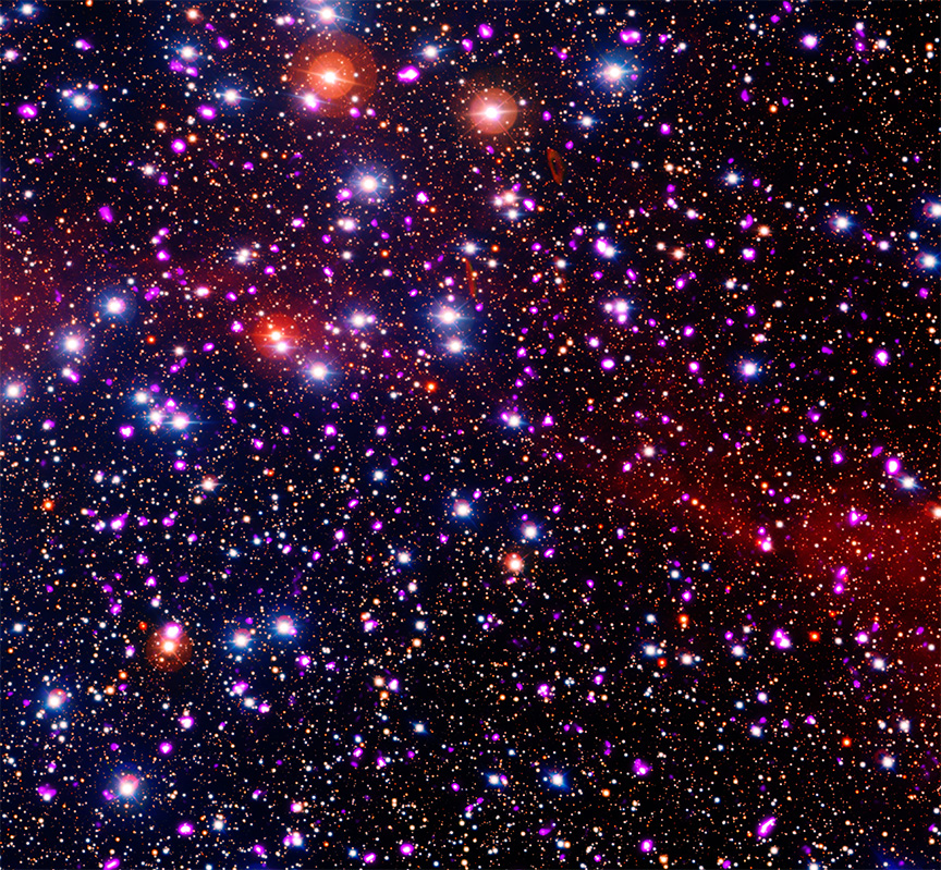 star cluster resembles a black canvas stippled with thousands of drops of colorful paint, flicked from an artist’s brush