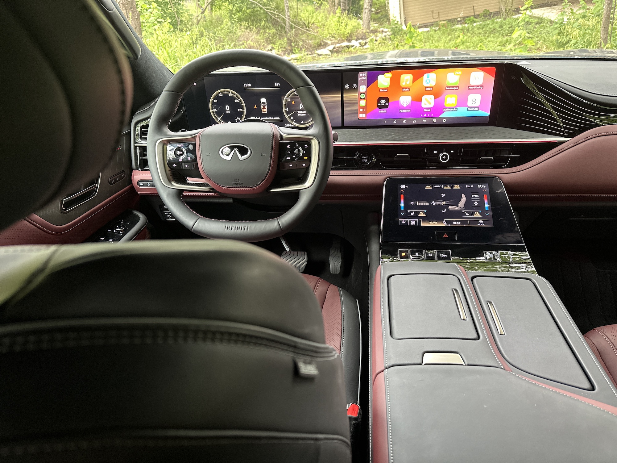 the interior of a car with dual infotainment screens