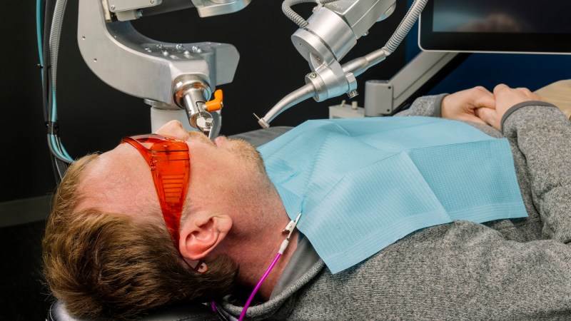 Perceptive robot dental machine working on human patient