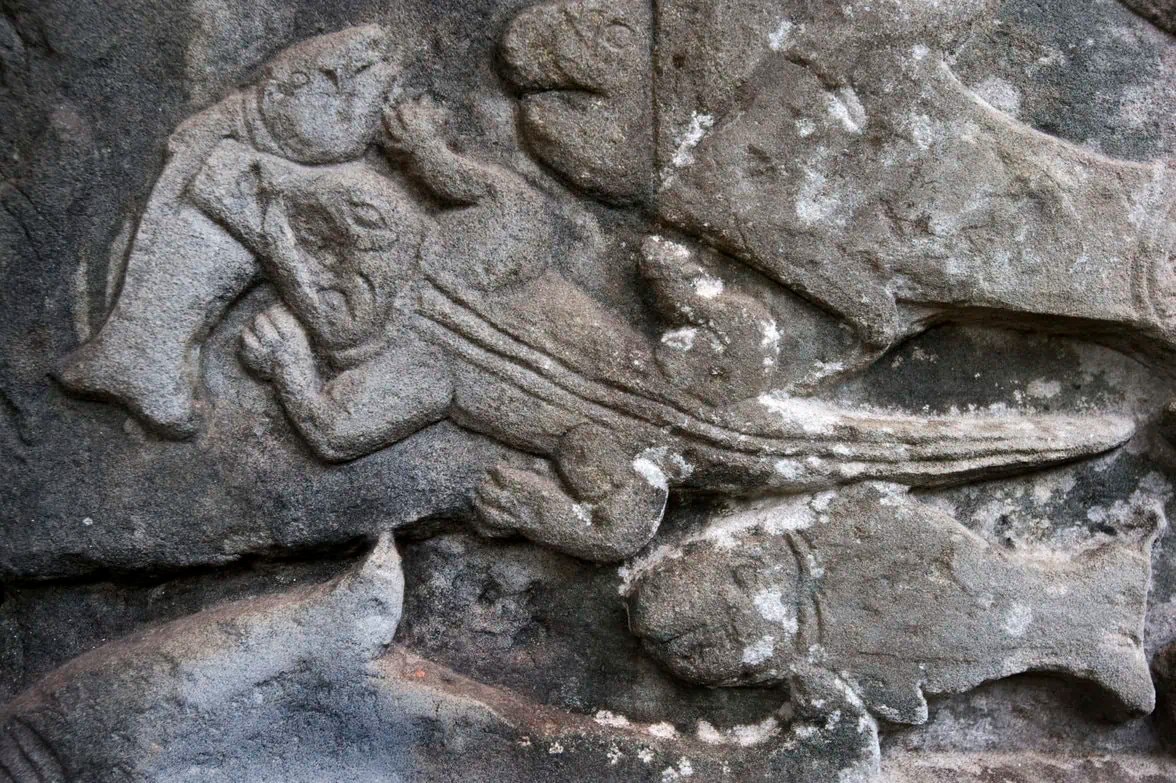 rock engravings featuring crocodiles at the ancient temples of Angkor Wat in Cambodia