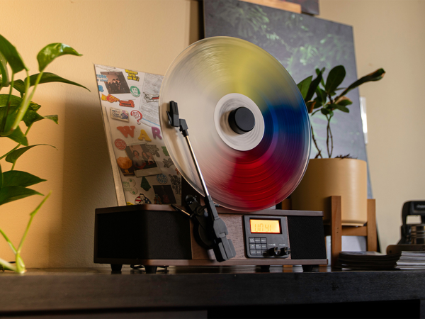 A vertical record player on a shelf