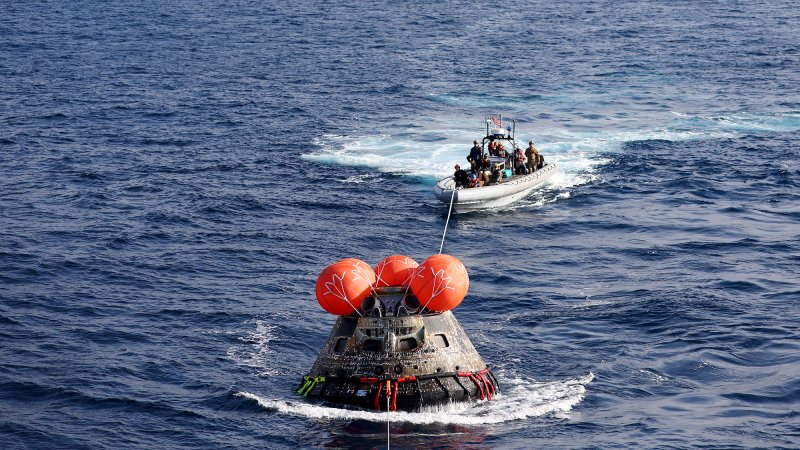 NASA's Orion Capsule is drawn into the well deck of the USS Portland during recovery operations after it splashed down in the Pacific Ocean off the coast of Baja California, Mexico, on December 11, 2022. - Orion was launched November 16 on the Artemis rocket for a 25-day mission to the Moon. The main goal of this mission was to test Orion's heat shield -- for the day when it is humans and not test mannequins riding inside. (Photo by Mario Tama / POOL / AFP) (Photo by MARIO TAMA/POOL/AFP via Getty Images)