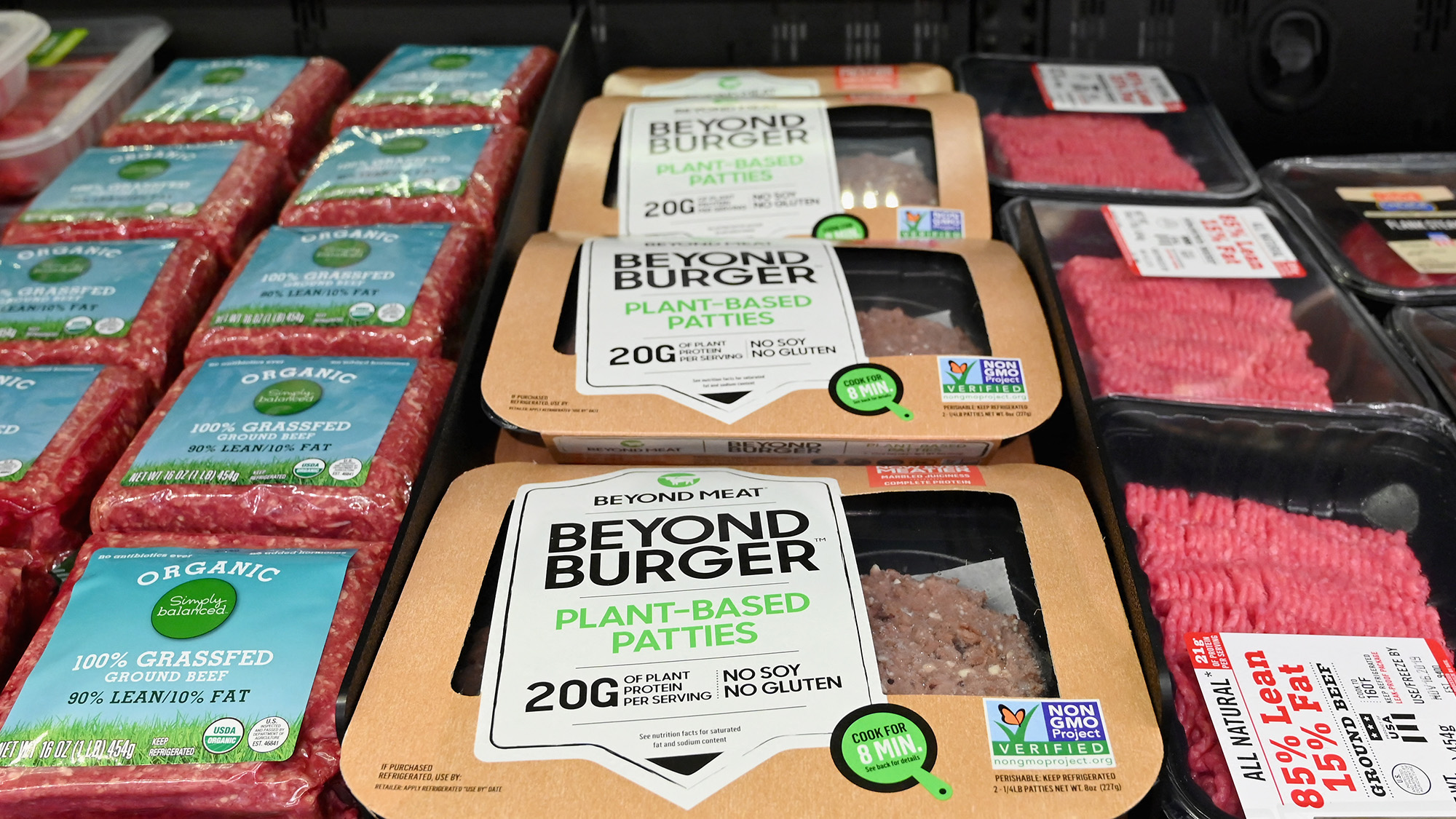 meat and plant-based meat on a shelf at the grocery store