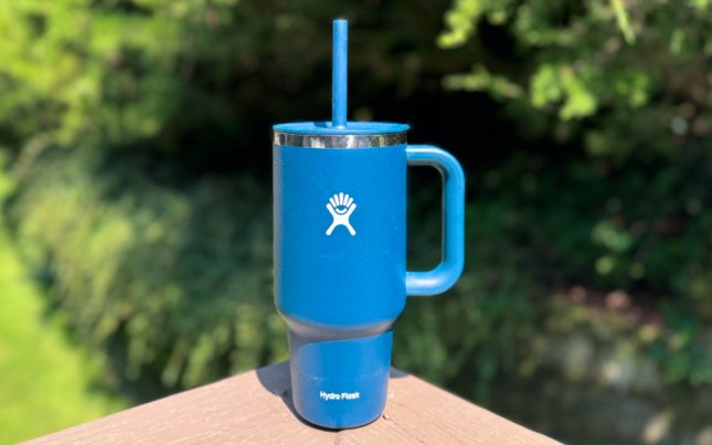 HydroFlask Travel Tumbler on a ledge.