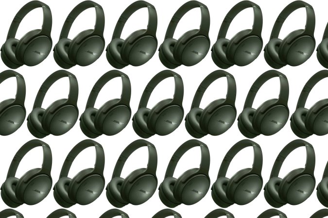 An array of dark green Bose QuietComfort headphones in a pattern on a plain background.