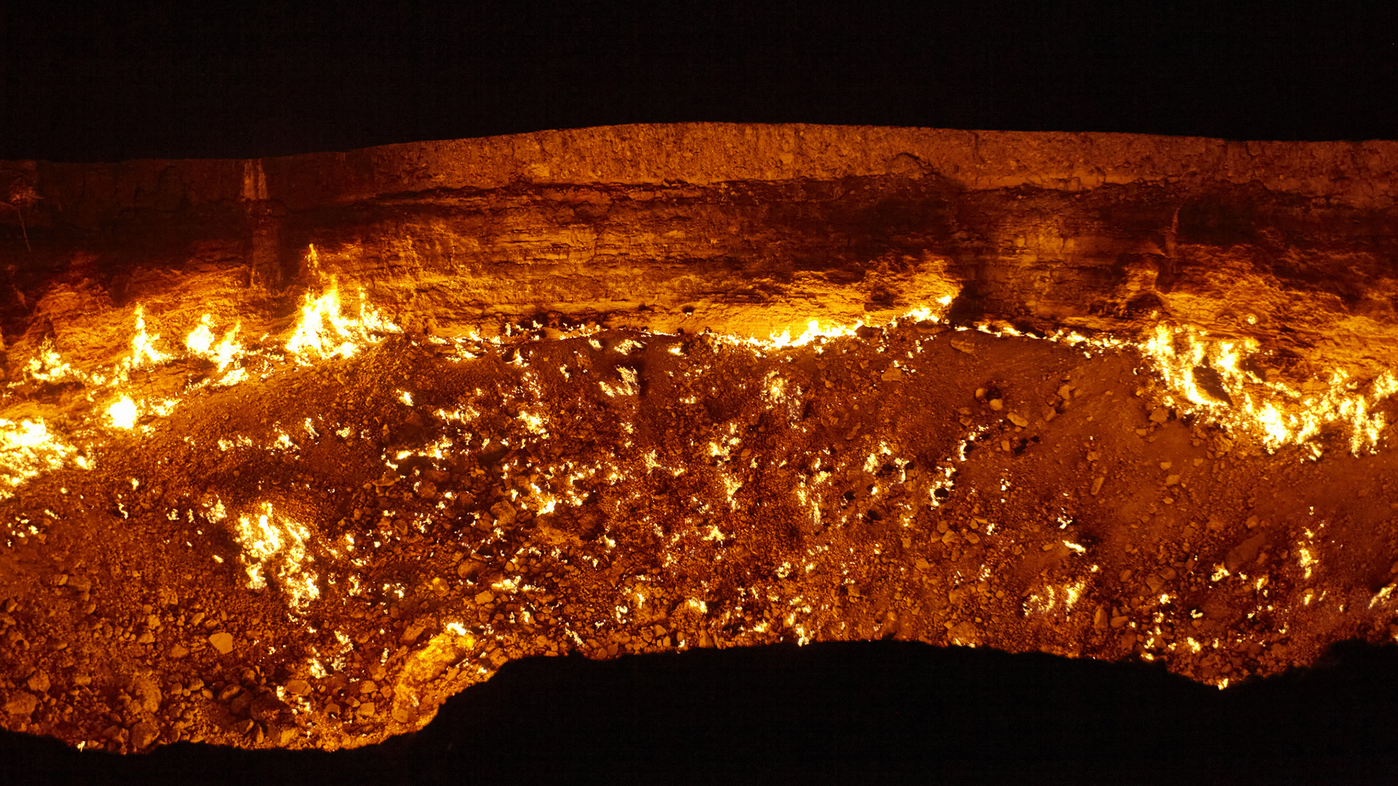 Close-up of the burning Darvaza gas crater at night, Turkmenistan.