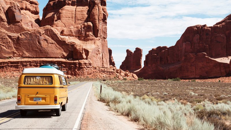 a van driving in desert