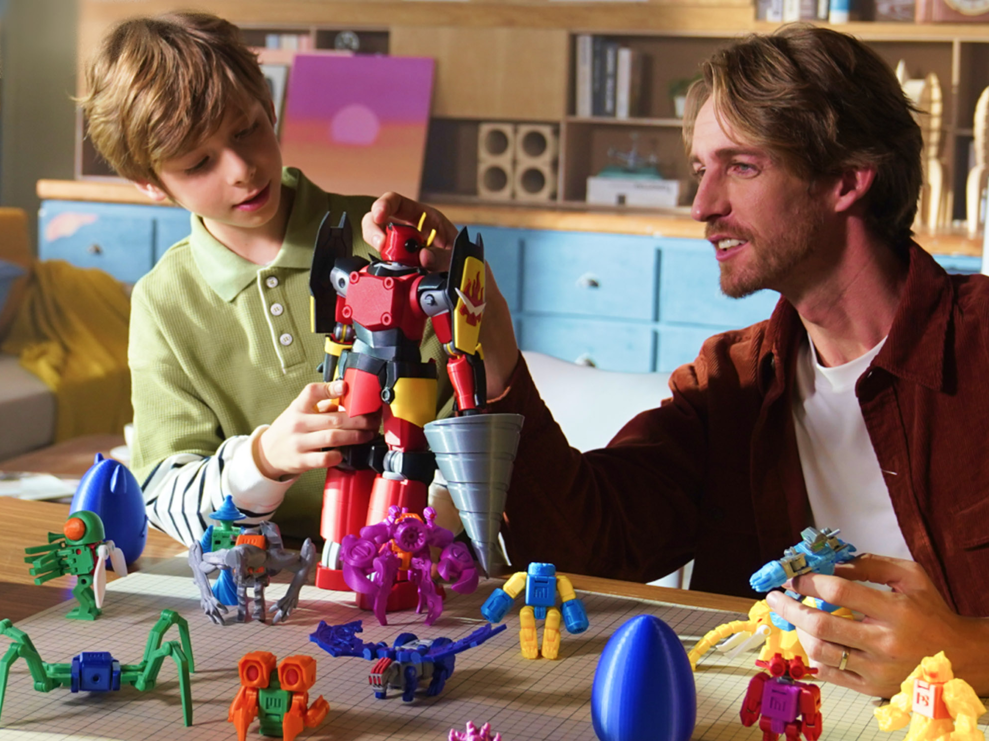 A father and son playing with a toy.