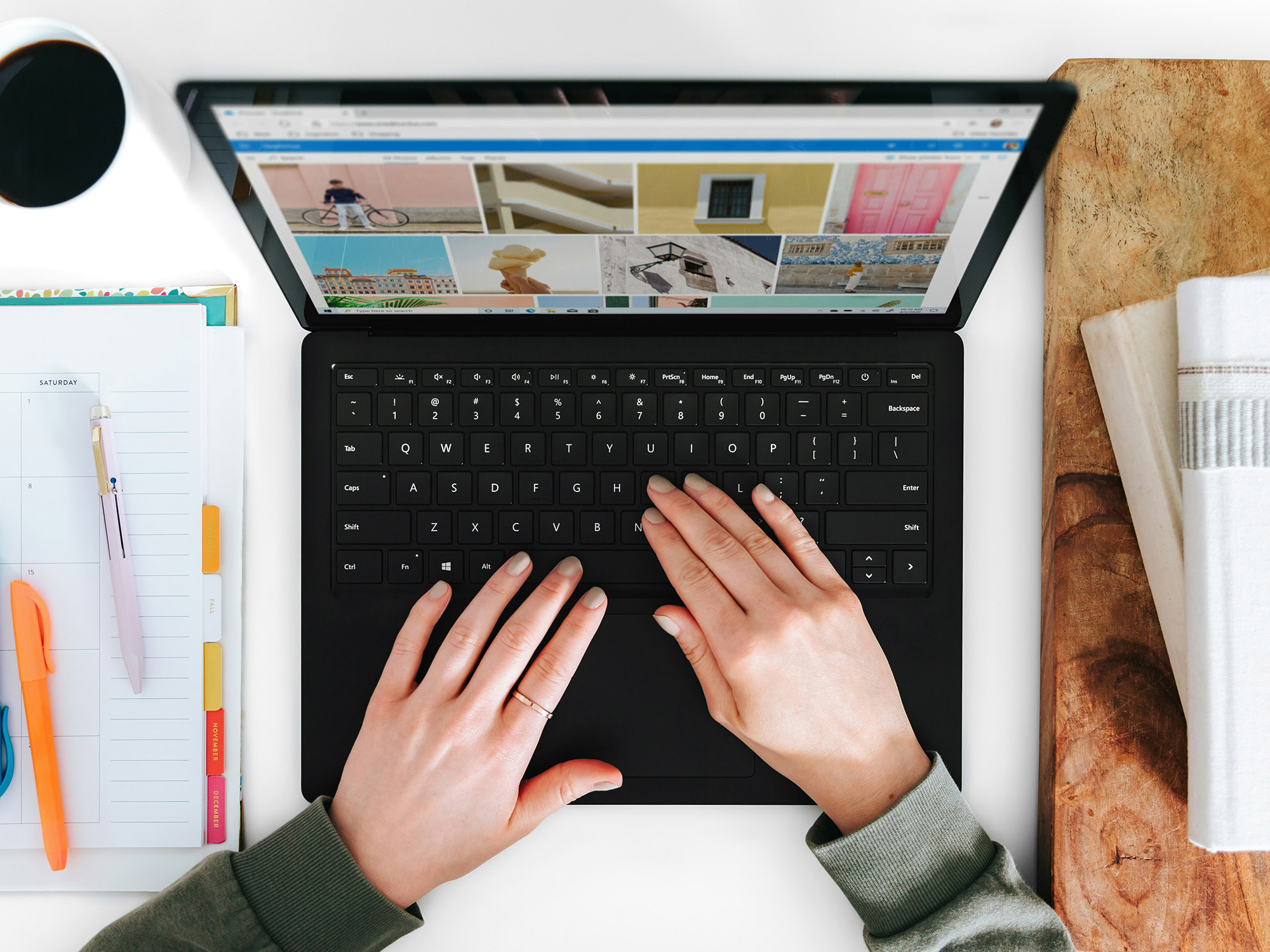 A person typing on a laptop.