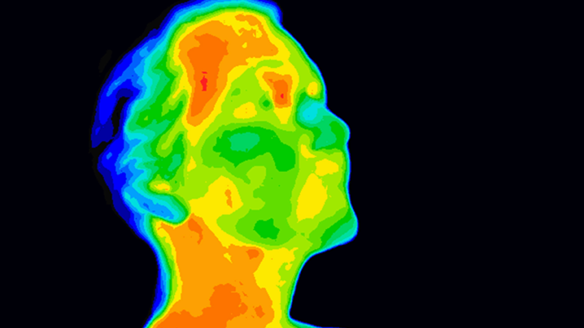 an infrared image of a human head, showing warm areas in shades of orange and yellow, and cooler areas in blue and green