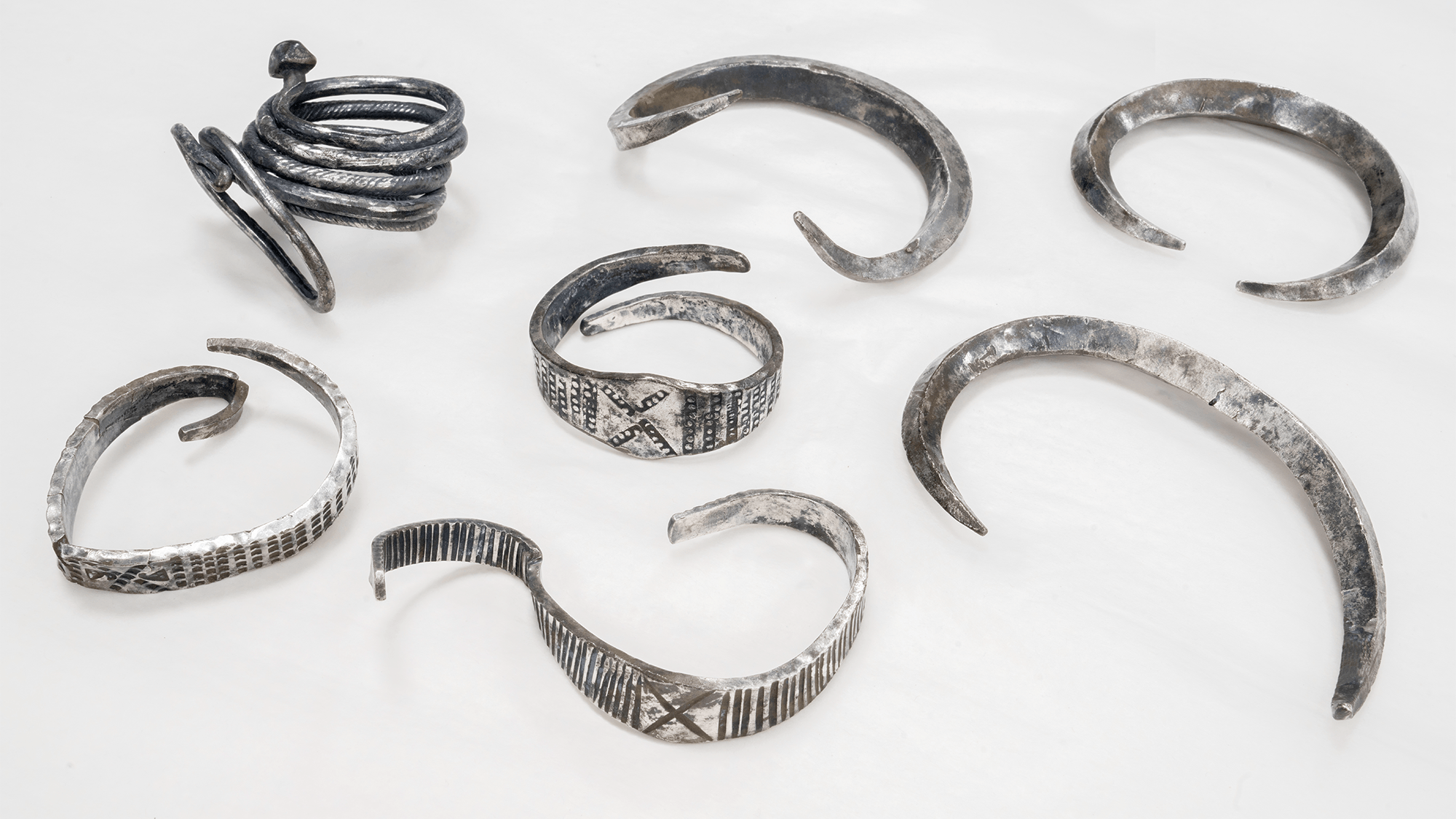 seven circular pieces of silver dating back to the viking age