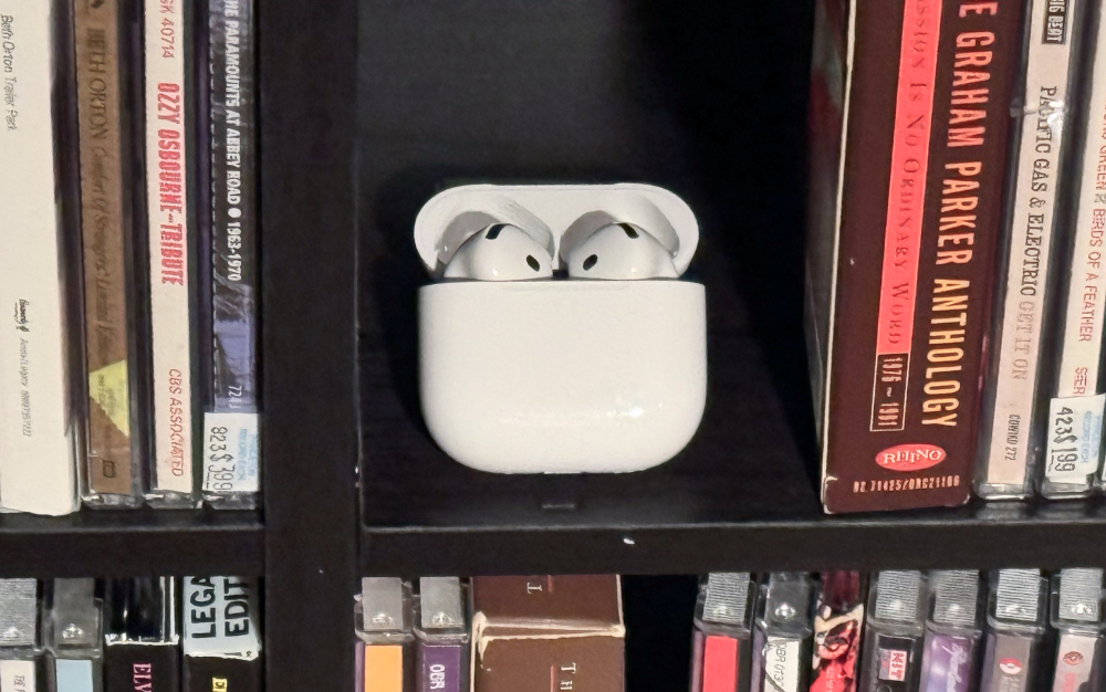 Science and Nature news AirPods 4 with Active Noise Cancellation near CDs.