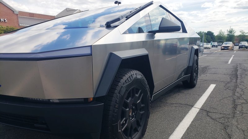 Tesla electric Cybertruck parked in the shopping plaza. Front view.