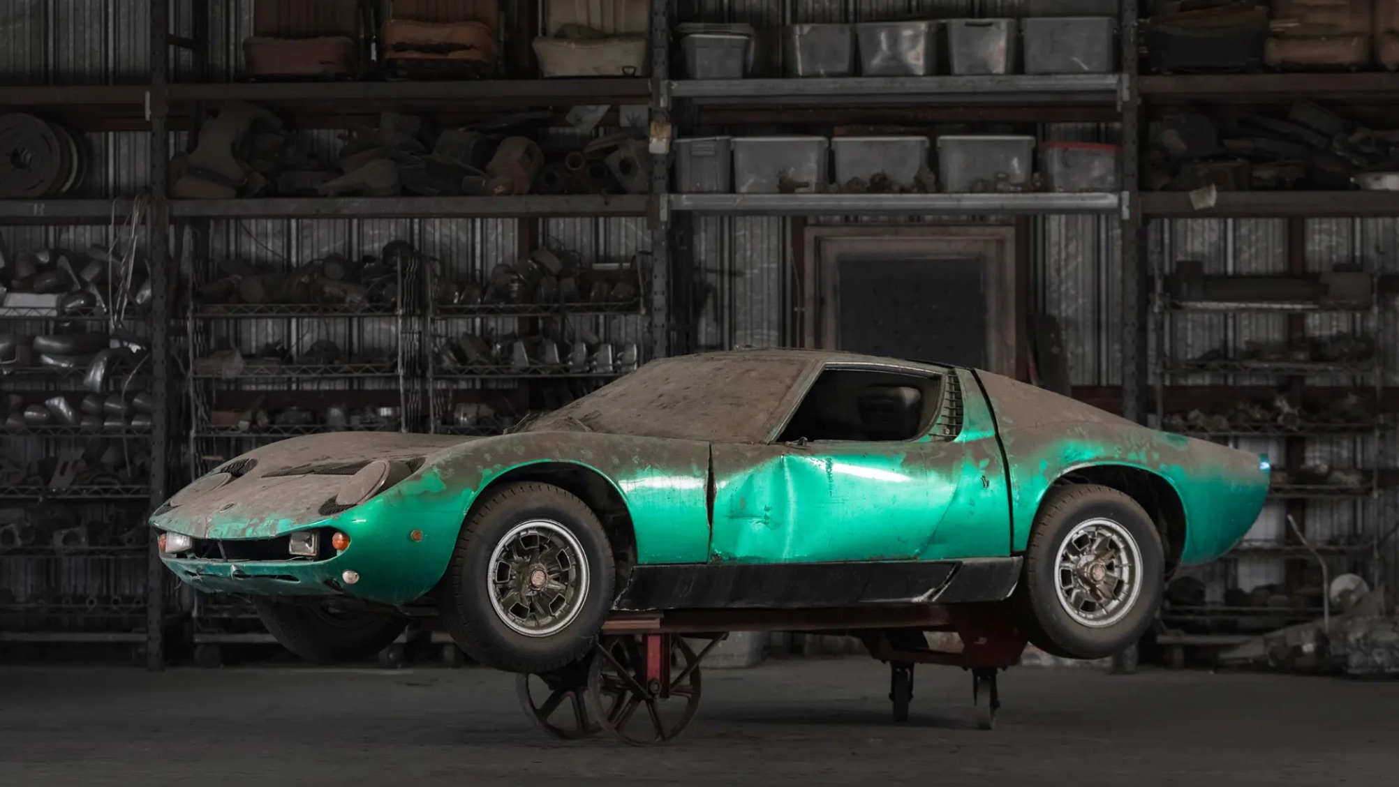 a green supercar covered in dirt