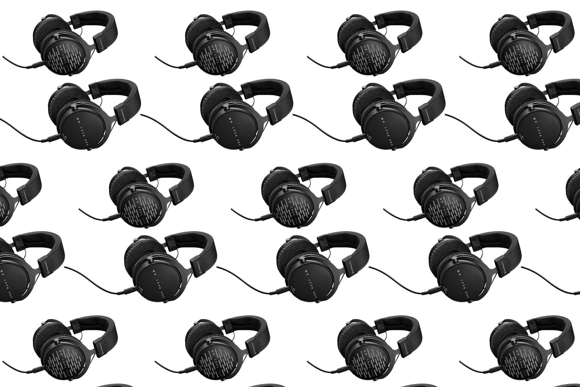 Beyerdynamic headphones in a pattern on a plain background.