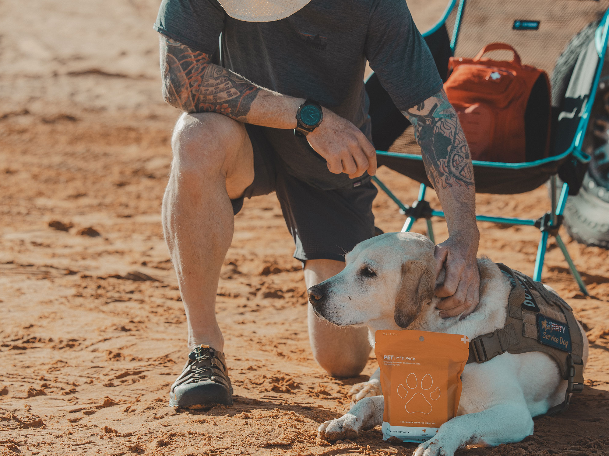 A person taking care of their dog using a first aid kit