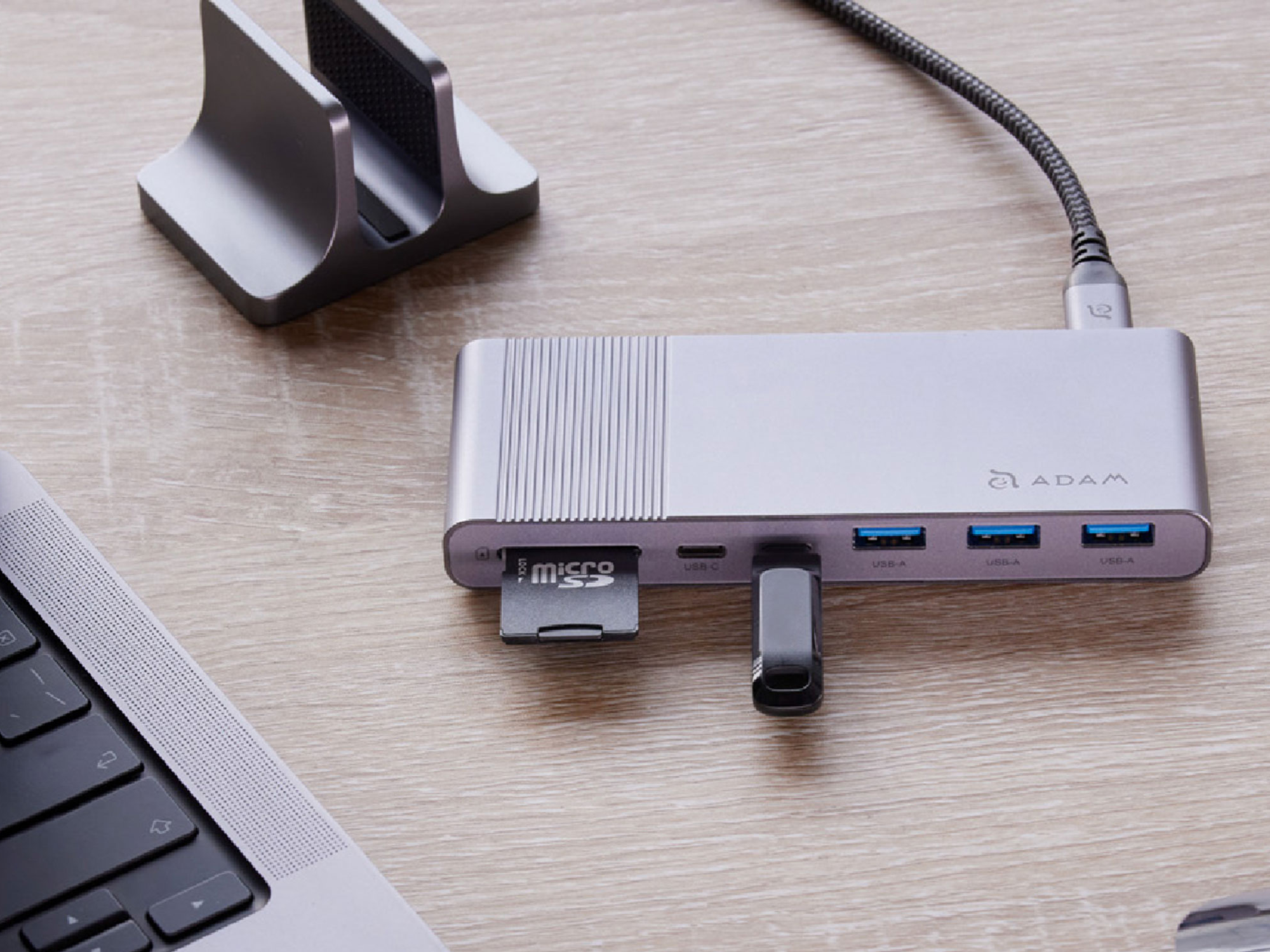 A laptop USB hub sitting on a desk.