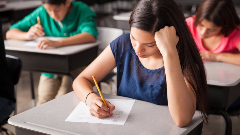 kids in school taking a test